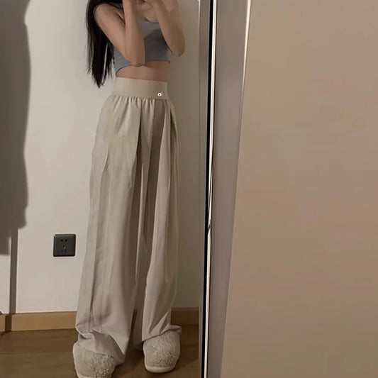 Hands-in-pocket stance with lounge pants
